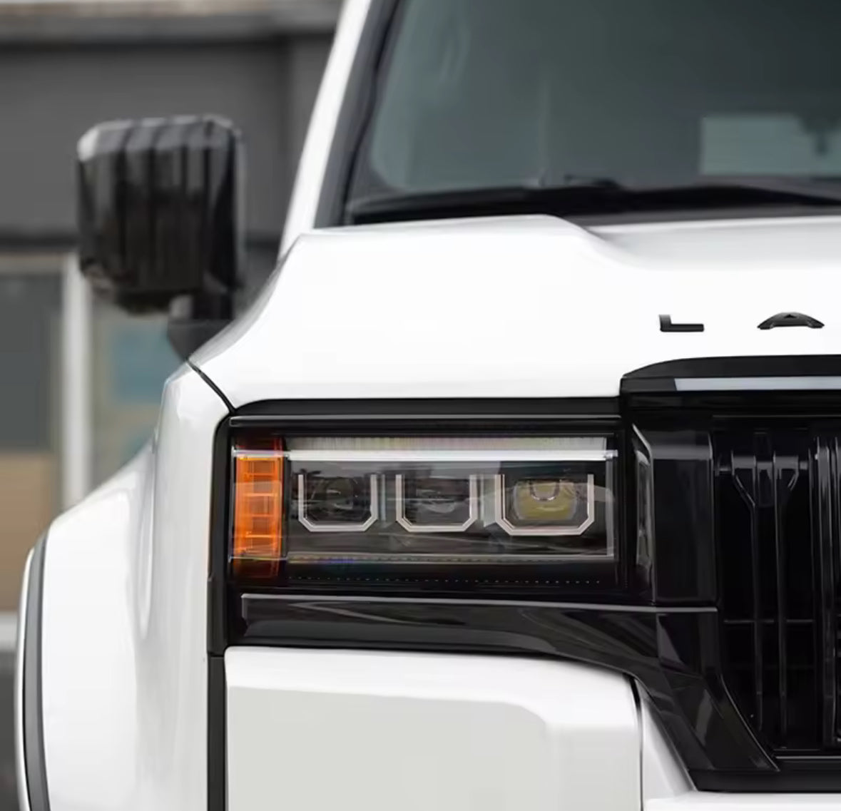 Prado 250 - Headlight Trim Overlay