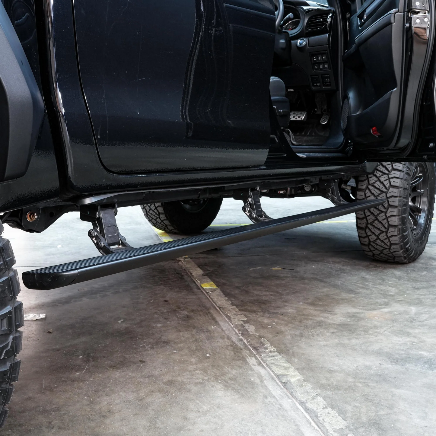 N80 HILUX ELECTRIC SIDE STEPS VIKOR INDUSTRIES